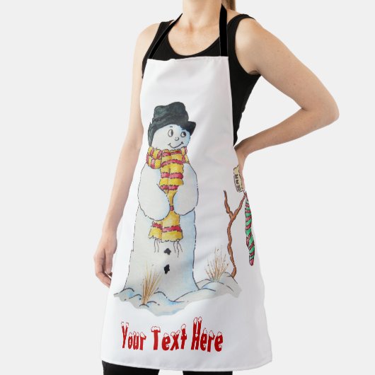 雪だるまはおもしろいクリスマスのために雪の中で微笑む エプロン (インサイチュ)