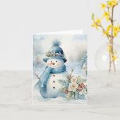 雪だるまブルーハットスカーフ雪に覆われた木空白の カード (黄色い花)