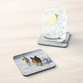 雪で走っているジャーマン・シェパード コースター (右側)