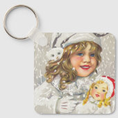 雪に人形をビクトリアン持つヴィンテージクリスマスガール キーホルダー (正面)