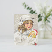 雪に人形をビクトリアン持つヴィンテージクリスマスガール シーズンポストカード (スタンド正面)