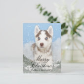 雪に坐っている青い目のハスキーな子犬 シーズンポストカード (スタンド正面)