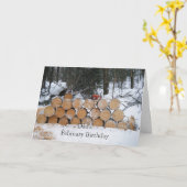 雪に積もった切丸太の山 カード (黄色い花)