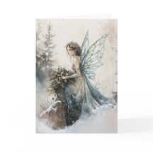 雪に花束を持つ水色のクリスマスフェアリー