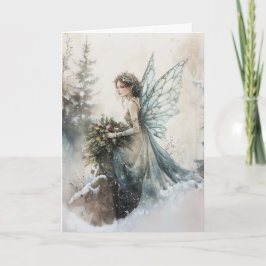雪に花束を持つ水色のクリスマスフェアリー カード