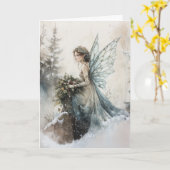 雪に花束を持つ水色のクリスマスフェアリー カード (黄色い花)