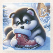 雪に覆われたウィンターブーツで遊ぶ子犬 ガラスコースター (正面)
