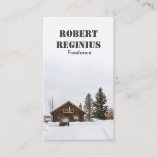 雪に覆われた茶色の木造の家 名刺
