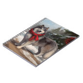 雪のクリスマスにアラスカンマラムート犬 ノートブック (左側)