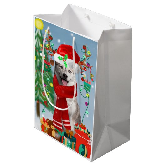 雪のクリスマスにシベリアのハスキー犬 ミディアムペーパーバッグ (裏面アングル)