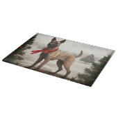 雪のクリスマスにベルギーのマリノワンドッグ カッティングボード (角)