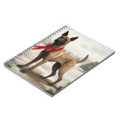 雪のクリスマスにベルギーのマリノワンドッグ ノートブック (左側)