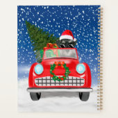 雪のクリスマスに車を運転するシュナウツァードッグ プランナー手帳 (裏面)