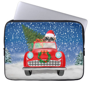 雪のクリスマスに車を運転するシーズー ラップトップスリーブ