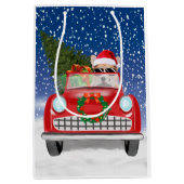 雪のクリスマスに車を運転するCorgi犬 ミディアムペーパーバッグ (正面)