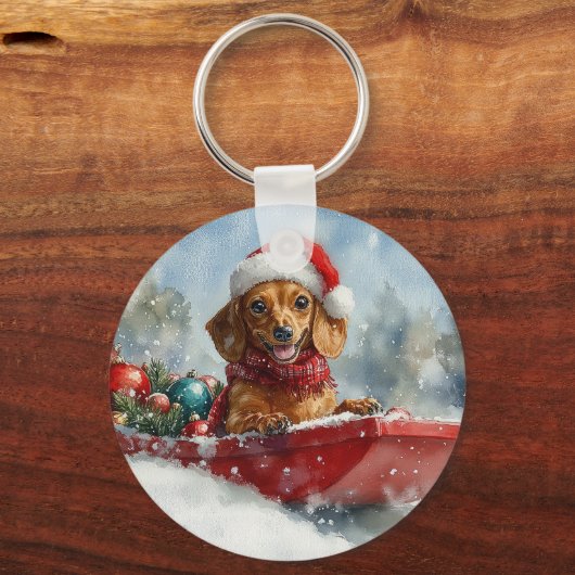 雪のクリスマスを許すそりにダックスシュント犬 キーホルダー (正面)