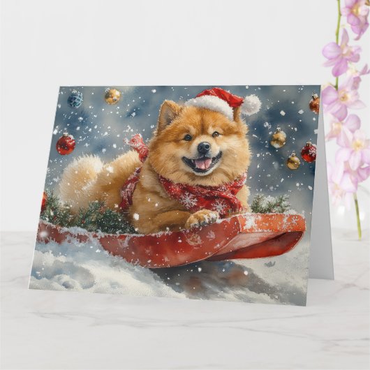 雪のクリスマスを許すそりにチョウの犬 カード (蘭)