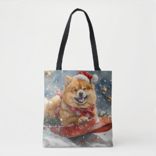 雪のクリスマスを許すそりにチョウの犬 トートバッグ
