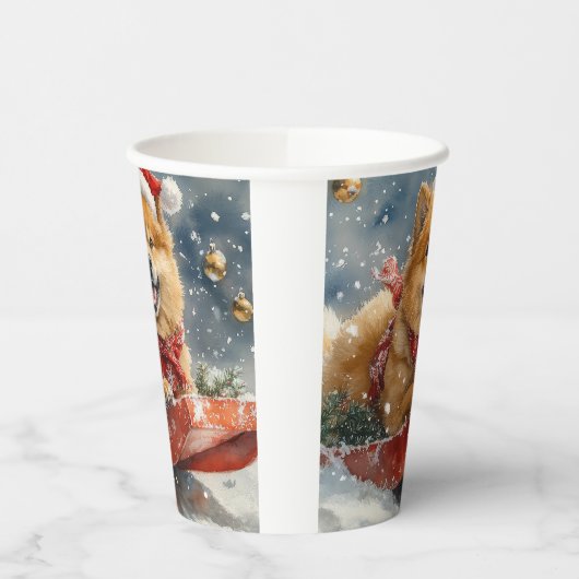 雪のクリスマスを許すそりにチョウの犬 紙コップ (左)