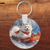 雪のクリスマスを許すそりのサモイド犬 キーホルダー (正面)