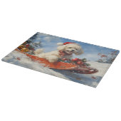 雪のクリスマスを許すそりのプードル犬 カッティングボード (角)