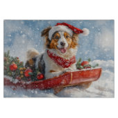 雪のクリスマスを許すそりのラフなコリー犬 カッティングボード (正面)