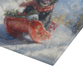 雪のクリスマスを過ごすスロッジのニューファンドランド犬 カッティングボード (角)