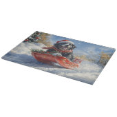 雪のクリスマスを過ごすスロッジのニューファンドランド犬 カッティングボード (角)