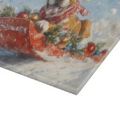 雪のクリスマスを過ごすソリに包まれたボクサー犬 カッティングボード (角)