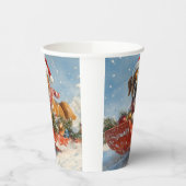 雪のクリスマスを過ごすソリに包まれたボクサー犬 紙コップ (左)