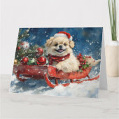 雪のクリスマスを過ごすソリのペキン犬 カード (正面)