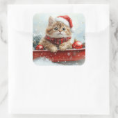 雪のクリスマスを過ごすソリのペルシャ猫 スクエアシール (バッグ)