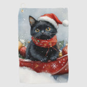 雪のクリスマスを過ごすソリの黒猫 ゴルフタオル (正面)