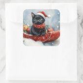 雪のクリスマスを過ごすソリの黒猫 スクエアシール (バッグ)