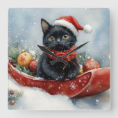 雪のクリスマスを過ごすソリの黒猫 スクエア壁時計 (正面)