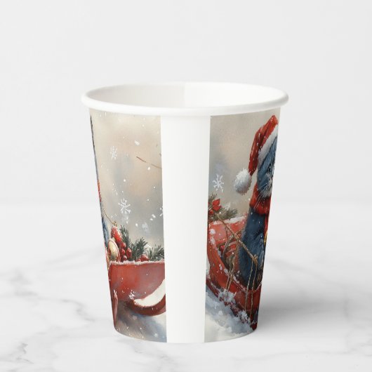 雪のクリスマスを過ごすソリ姿のオリエンタルブルー猫 紙コップ (左)