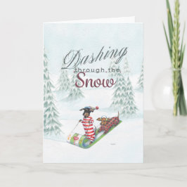 雪のクリスマスカードを通したダックスフント シーズンカード