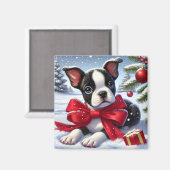 雪のクリスマスシーンで赤い弓で子犬 マグネット (正面/裏面)