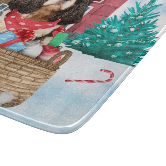 雪のクリスマスドッグハウスに入ったキャバリエのキングドッグ カッティングボード (角)