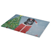 雪のクリスマスプレゼントに黒いドイツの羊飼い犬 カッティングボード (角)