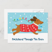 雪のクリスマスホリデーを通してかわいいダックスシュント シーズンポストカード (正面/裏面)