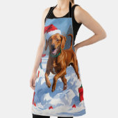 雪のクリスマス帽子をかぶったビズスラのラン エプロン (インサイチュ)