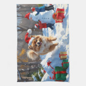 雪のクリスマス帽子をかぶったポメラニアンが走る キッチンタオル (縦)