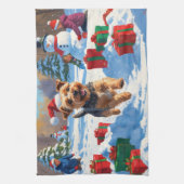 雪のクリスマス帽子を被ったスカイテリアが走る キッチンタオル (縦)