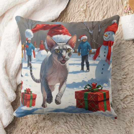 雪のクリスマス帽子を被ったスフィンクス猫が走る クッション (ブランケット)