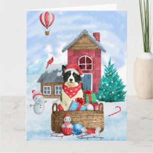 雪のクリスマス犬小屋にいるボーダーコリー犬 カード