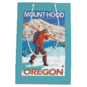 雪のスキー-山のフード--を運んでいるスキーヤーまたは ミディアムペーパーバッグ (裏面)