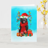 雪のニューファンドランドとクリスマスプレゼント カード (黄色い花)