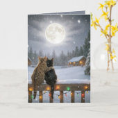 雪のフェンスで寄り添うクリスマスの猫たち カード (黄色い花)