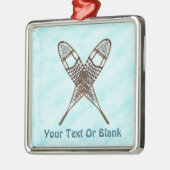 雪の上で雪の上を交差した靴 メタルオーナメント (左)